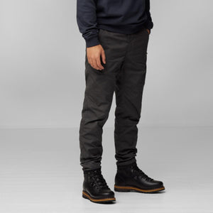 FjallRaven dark grey trousers worn with black leather hiking boots