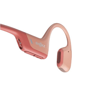 Pink Shokz bone conduction headphones with volume control buttons