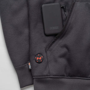 Mobile Warming battery pack connected to a heated hoodie pocket with a circular power control button