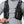 Person wearing a black Nathan hydration vest with front pockets and adjustable chest straps
