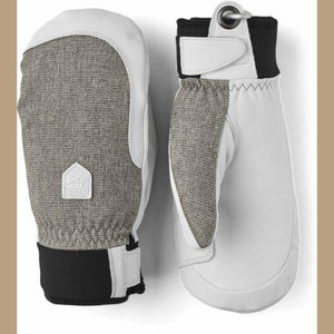 Hestra white and grey leather mittens with black cuffs and wrist straps