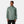 Man wearing a sage green Helly Hansen hooded rain jacket with HH logo