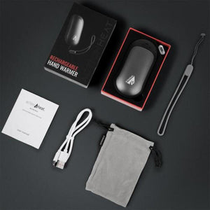 ActionHeat rechargeable hand warmer with box, charging cable, wrist strap, storage pouch, and user manual
