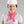 Woman wearing a white hard hat and a pink cooling neck scarf