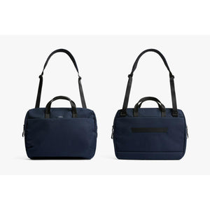 Front and back view of a navy blue Bellroy messenger bag with shoulder strap and carry handles