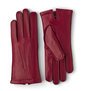Pair of red Hestra leather gloves