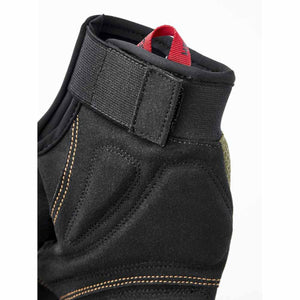 Close up of Hestra glove cuff with velcro strap and red pull tab
