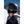 Back view of a person wearing a matte olive Smith Optics helmet with MIPS technology in a snowy mountain setting