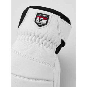 White Hestra leather glove cuff with brand logo patch