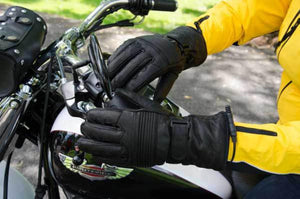 Warm and Safe black leather motorcycle gloves on handlebars