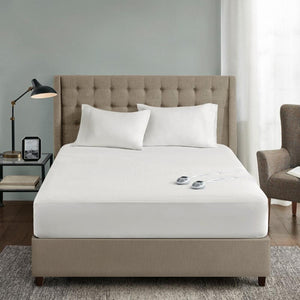 Serta heated mattress pad on a bed with two controllers