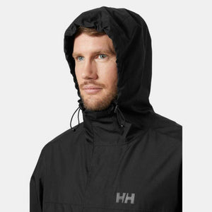Man wearing a black Helly Hansen hooded rain jacket