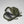 Open olive green FjallRaven backpack with laptop and clothing inside