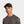 Man wearing a black Mission baseball cap