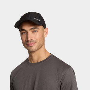 Man wearing a black Mission baseball cap