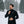 Man wearing a black Gobi Heat long sleeve quarter zip base layer in a snowy forest