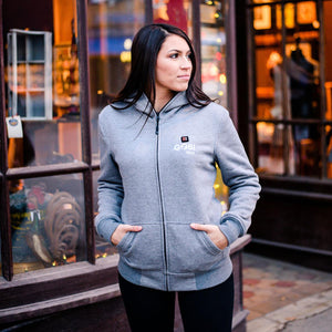 Woman wearing a grey Gobi Heat zip up hoodie with hands in pockets