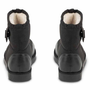 Back view of black ankle boots with white fleece lining and side strap detail