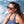 Woman wearing Smith tortoise shell sunglasses with mirrored lenses by the ocean