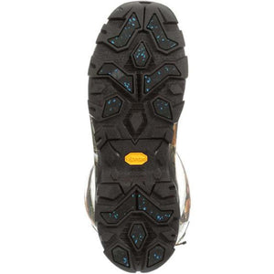 Black Vibram boot outsole with deep tread pattern and blue speckle details