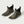 Huk camo ankle boots with white soles and orange pull tabs