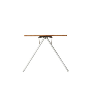 Side view of a folding table with a bamboo top and silver metal legs