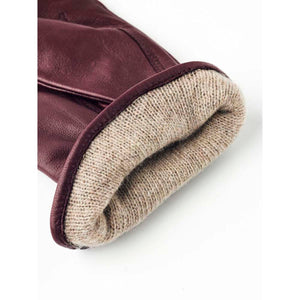 Hestra burgundy leather glove cuff with beige knit lining