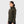 Woman wearing a dark green FjallRaven fleece hoodie with a front zipper