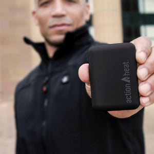 Person holding a black ActionHeat power bank