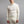 Man wearing a cream Merino Skins long sleeve quarter zip thermal top