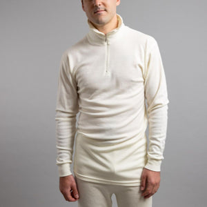 Man wearing a cream Merino Skins long sleeve quarter zip thermal top