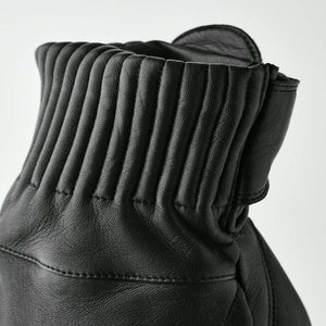 Close up of black Hestra leather glove cuff with ribbed detailing