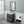 Wall mounted white electric heater next to a dark grey bathroom vanity with a marble countertop and mirror