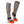 Mobile Warming grey heated socks with orange accents and side zipper