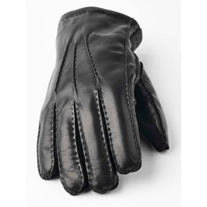 Black leather glove with decorative stitching on the back