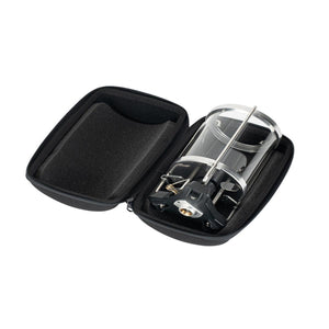 Portable camping stove inside a black protective zippered carrying case