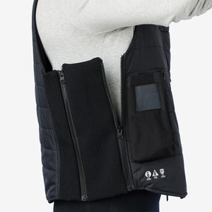 Side view of black quilted vest with expandable ribbed side panel and zippered pocket