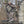 Hunter wearing a Heater Body Suit in Mossy Oak Breakup Country camo pattern while aiming a compound bow in a tree stand