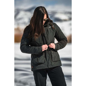 Person wearing a black insulated jacket with front pockets in a snowy outdoor setting
