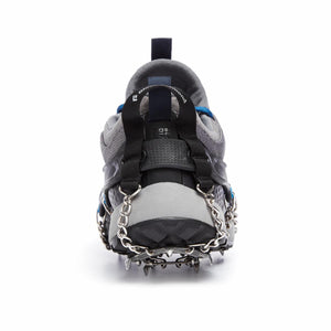 Black Diamond traction device attached to the heel of a grey trail running shoe