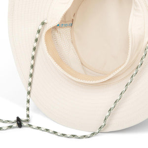 Interior view of a beige Mission sun hat showing mesh lining and adjustable chin strap