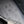 Water droplets on grey diamond pattern fabric of a Bellroy bag