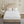 Beautyrest white quilted mattress pad on a bed with a beige headboard