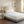 Beautyrest white quilted mattress pad on a bed with a beige headboard