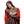 Woman wrapped in a brown ActionHeat heated blanket with visible heating element grid patterns