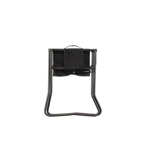 Snow Peak black folding stool in a closed position