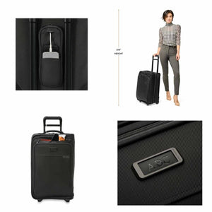 Briggs and Riley black carry on luggage showing charging port, scale, front pocket, and monogram tag