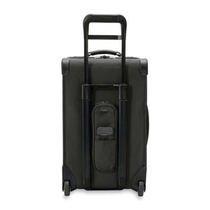 Back view of a black Briggs and Riley rolling suitcase with extended handle