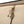 Beige Briggs and Riley garment bag strap with a black metal hanger hook