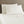 Shavel cream colored bed sheets and two pillowcases on a bed